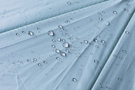water drop on green umbrella For backgroundの写真素材