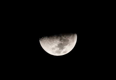 Half moon on black sky backgroundの写真素材