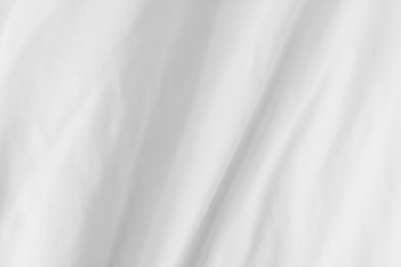 Close up of bedding White sheets with copy spaceの写真素材