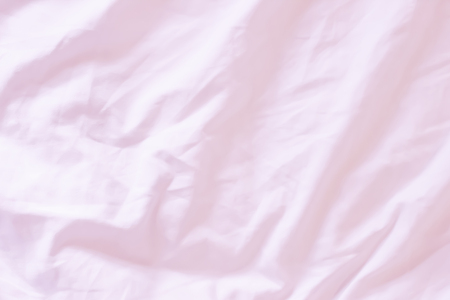 Close up of bedding pink sheets with copy spaceの写真素材
