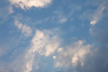 Blue sky with soft white clouds