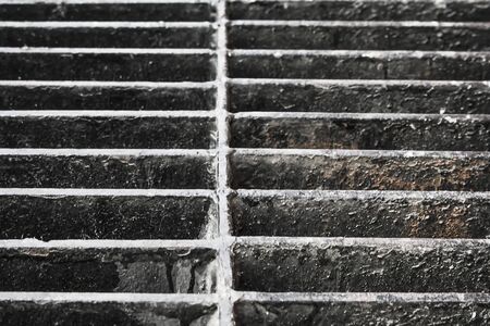 Old iron drain hatchの写真素材