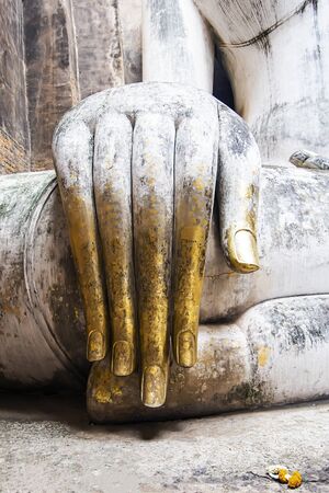 The hands of the Buddha statues of the Buddha are respected by the peopleの写真素材