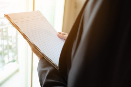 Portrait asia woman engineer steel plant checking site on her note at construction siteの写真素材