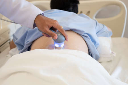 Closeup ultresound physical therapy the back of the man in hospital.の写真素材