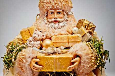 Santa Claus with golden Christmas giftsの写真素材