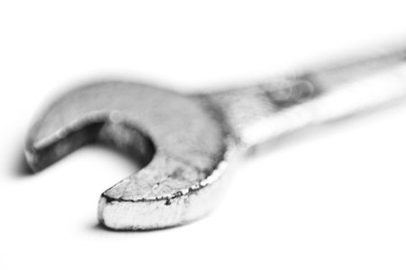 used old wrench closeup isolated on white background