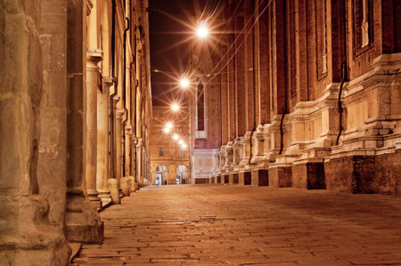 old city street at night. bologna italyの写真素材