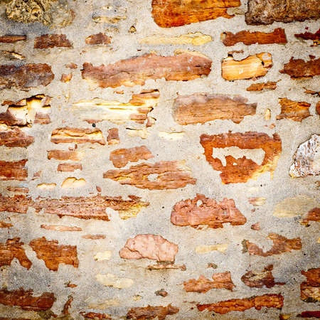 Background of stone wall texture. closeup of ancient stone wallの写真素材