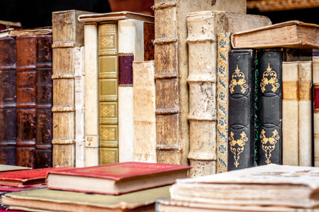 Books with leather covers in a row. Old manuscripts. Aged, used books.の写真素材
