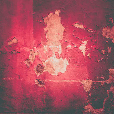 Damaged wall texture. Orange paint peeling of wall.の写真素材