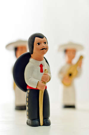 Statue depicting mexican man with sombrero on a white background. Traditional costume of Mexico.の写真素材