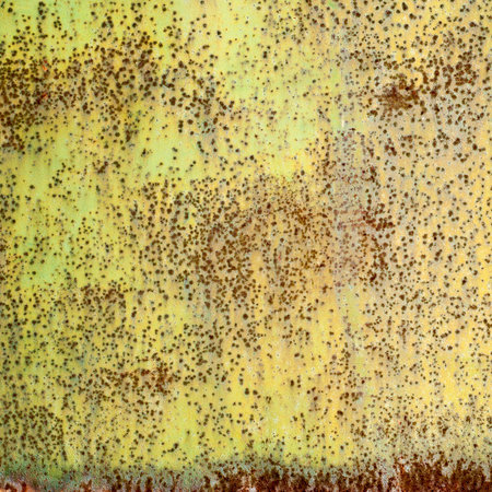 Grunge texture background overlay. A close-up view of a metal surface with weathered paint. The...