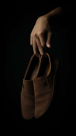 Leather Shoes with Elegant Style on Black Backgroundの写真素材