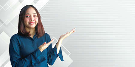 Cheerful young businesswoman showing presentation text Add your own text hereの写真素材