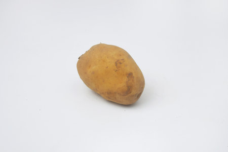 One round potato on an isolated white backgroundの写真素材
