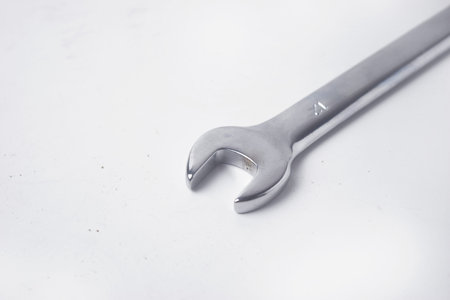 Wrenches 10 and 12 are used to service several items on an isolated white background