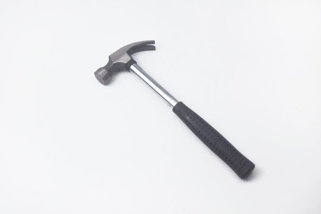 Photo of a hammer seen from above. Hammers are used as carpentry tools. The hammer is on an isolated white backgroundの写真素材