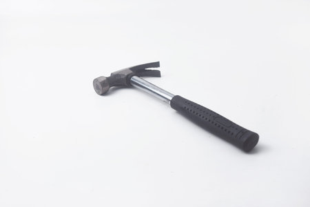 Photo of a hammer seen from above. Hammers are used as carpentry tools. The hammer is on an isolated white backgroundの写真素材