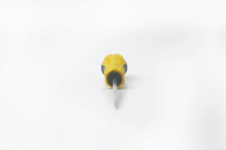 Closeup photo of A yellow screwdriver is on an isolated white backgroundの写真素材
