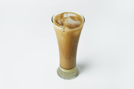 Chocolate iced coffee in glass on white isolated background