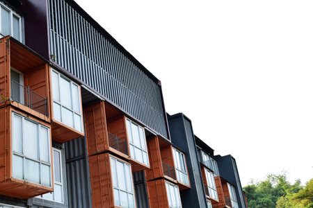 The industrial-themed container hotel building with a sky background is in the city of Batu, Malangの写真素材