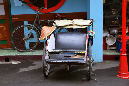 The wooden rickshaws at a tourist spot in Batu city look very aestheticの写真素材