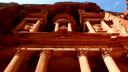 View looking up at Al Khazneh the treasury house of Petra ancient city in Jordanの写真素材