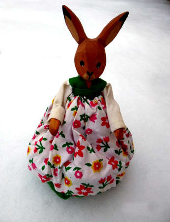 Easter bunny in the snow with copy space for text happy easter in gardenの写真素材