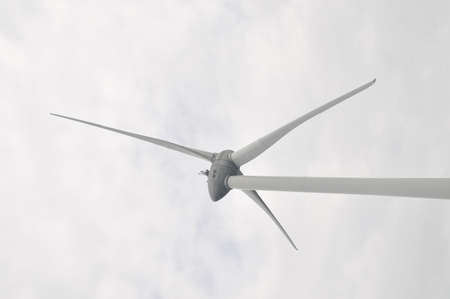 Wind turbine close up with cloudy skyの写真素材