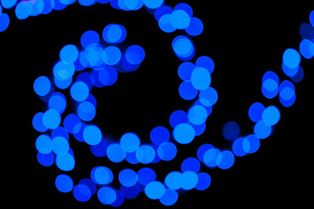 Photo of blue abstract circular bokeh background of Christmaslight