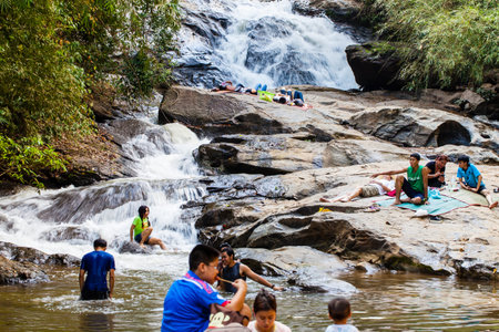 People are swimming in free day at Mae Sa waterfall Doi Suthep-Pui national park, North Thailandのeditorial素材