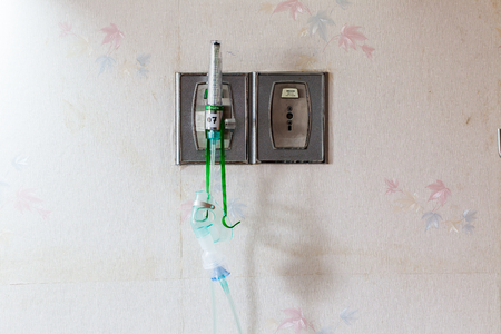 Medical oxygen mask and valve setting on wallの写真素材