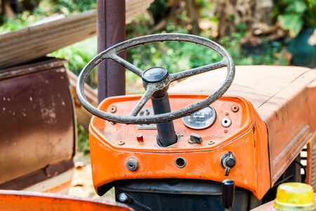 vintage of steering wheel farm tractorの写真素材
