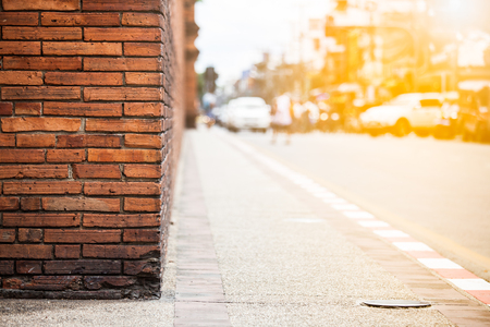 Orange brick wall with traffic in sunset, Chiang Mai Thailandの写真素材