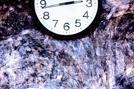 Part of clock on colorful polished plaster wall