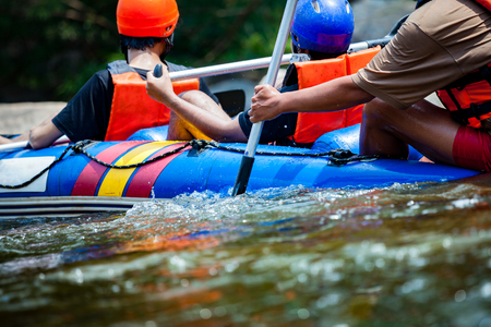 Focus some part of young person are rafting in river.の写真素材