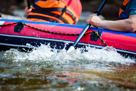 Focus some part of young person are rafting in river.