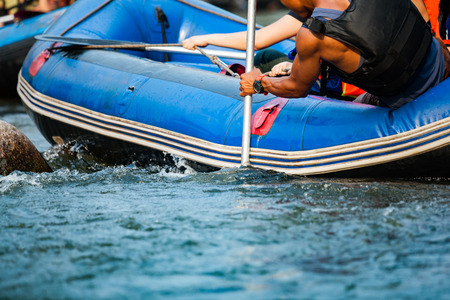 Close-up of young person rafting on the river, extreme and fun sport at tourist attractionの写真素材