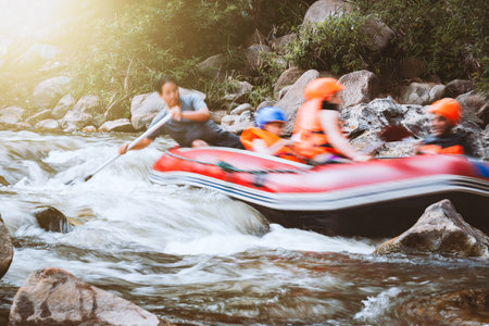 Motion blur of young person rafting on the river, extreme and fun sport at tourist attractionの写真素材