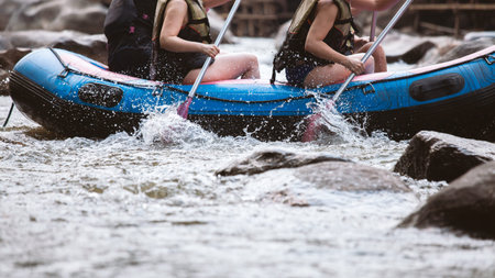 Young person rafting on the river, extreme and fun sport at tourist attraction natural park