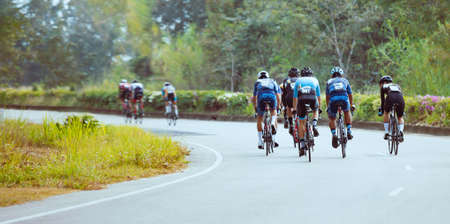 Group of professional cyclists during the cycling race. Shot in back - Imageの写真素材