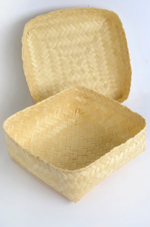 Wicker basket isolated on white background. Basket made of bamboo.