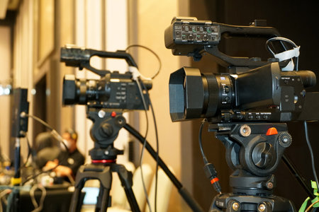 professional video camera broadcasting on tripod for recording Corporate Event. Video production.のeditorial素材