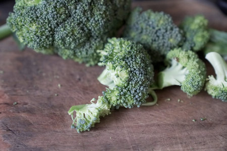 Fresh broccoli on wooden background. Selective focus with shallow depth of field.の写真素材