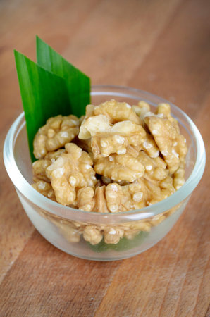 Delicious walnuts peanut on a glass bowl