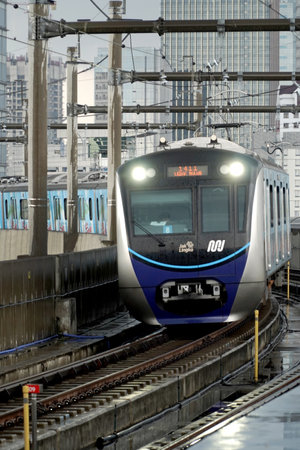 Jakarta, Indonesia: Mass Rapid Transit (MRT) train transport near fatmawati Station Jakarta, in rainy day. One of solution transport to reduce traffic Jam in rush hour.のeditorial素材