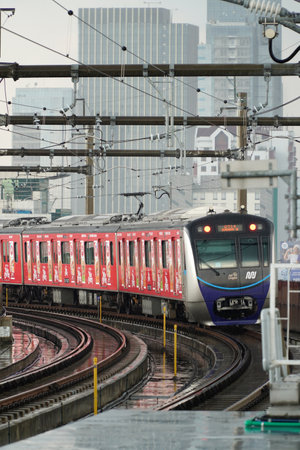 Jakarta, Indonesia: Mass Rapid Transit (MRT) train transport near fatmawati Station Jakarta, in rainy day. One of solution transport to reduce traffic Jam in rush hour.のeditorial素材
