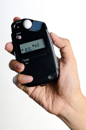 hand holding light meter photography equipmentのeditorial素材