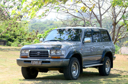 Car in the park on the beach, Great car, Toyota Land Cruiser Turbo 1997, Diesel engine, 4x4 off road, Sanur, Bali, Indonesiaのeditorial素材